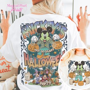 May include: White t-shirt with a colorful graphic of Mickey Mouse and friends celebrating Halloween. The graphic says "Mickey's Not So Scary Halloween Party".