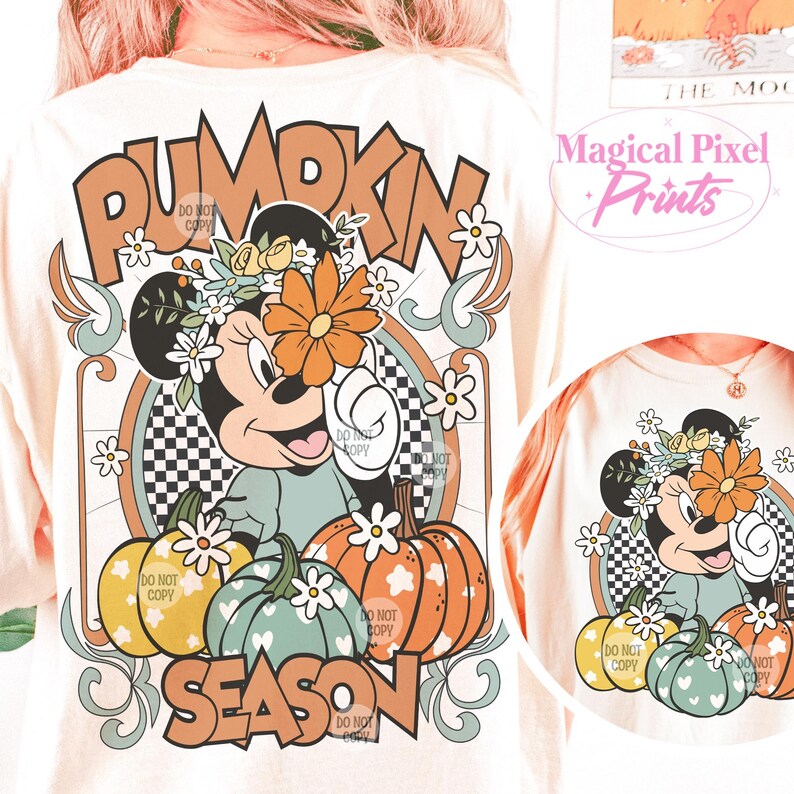 May include: A white t-shirt with a graphic design featuring a cartoon mouse with a flower crown, pumpkins, and the text "Pumpkin Season".