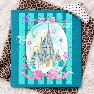 May include: A teal square featuring a castle illustration within an oval frame, embellished with pink bows and stars. The castle is rendered in blue, pink, and yellow hues, with two birds and the text "Magical Pixel Prints".