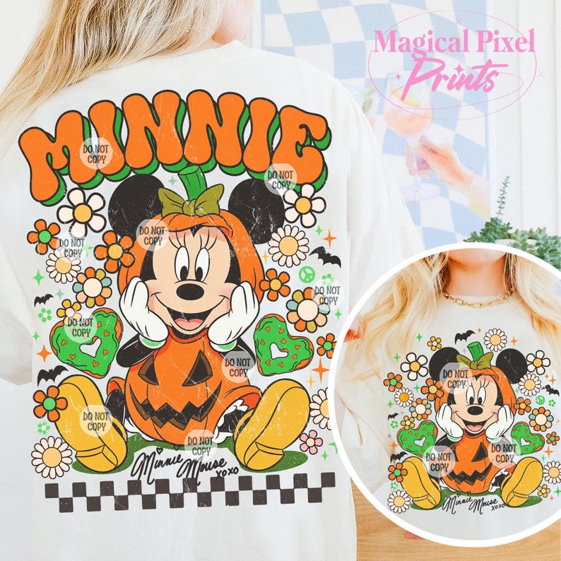 May include: Cream-colored t-shirt featuring a Halloween-themed Minnie Mouse design. The graphic shows Minnie in a pumpkin costume, surrounded by flowers, hearts, and bats. The word "MINNIE" is arched across the top. Text includes "Minnie Mouse" and "xoxo".