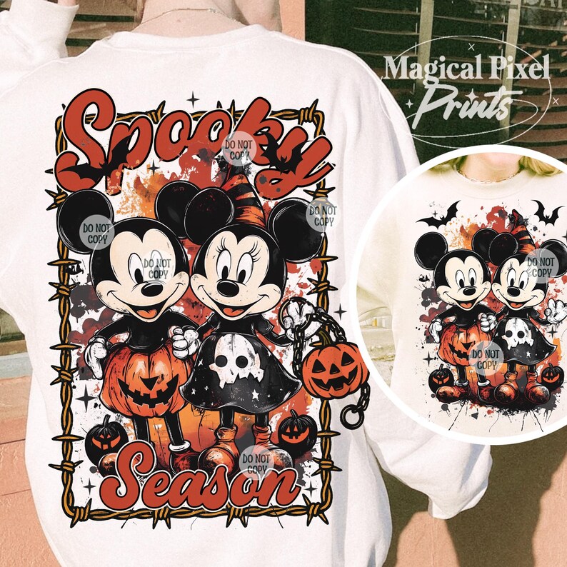 May include: White sweatshirt featuring Mickey and Minnie Mouse in Halloween costumes, holding jack-o'-lanterns. The design includes the words "Spooky Season" in a Halloween-themed font, with a barbed wire border.