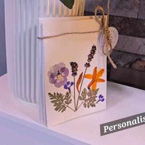 A personalised card in each bouquet made of home grown pressed flowers.