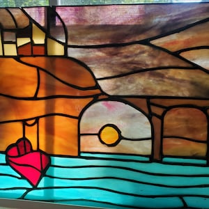 Stained glass boat in water