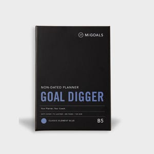 May include: A black non-dated planner with the text "GOAL DIGGER" in blue. The planner includes the text "Your Planner, Your Coach" and "CLASSIC ELEMENT BLUE". The planner is B5 size.