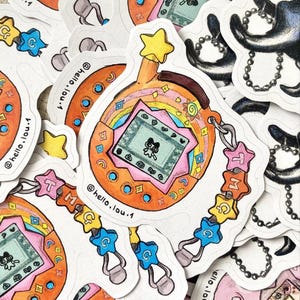 Stickers Autocollants Illustrés inspirés des Tamagotchi, parfait pour décorer et customiser vos appareils électroniques ou une gourde!