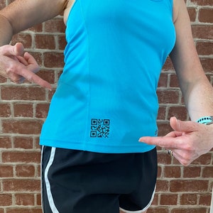 May include: A light blue athletic tank top with a black and white QR code on the front. The tank top is paired with black athletic shorts with white trim.