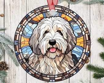 May include: A stained glass ornament featuring a white and brown Old English Sheepdog with a blue, yellow, and orange background.