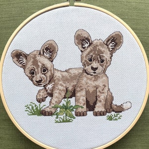9” Wild Dogs - Finished Cross Stitch