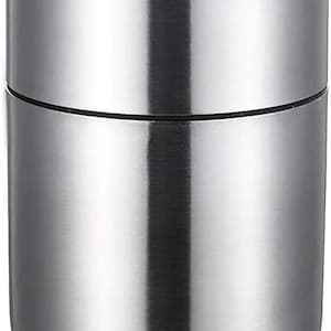 May include: A silver stainless steel ashtray with a round shape and a single slot for cigarettes.