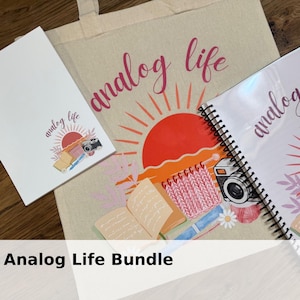 May include: An "Analog Life" bundle featuring a tote bag, notebook, and notepad. The items display a sunrise design with a camera, knitting, and open books. The text "analog life" is written in a cursive font.