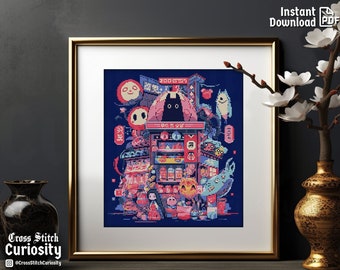 May include: Framed cross-stitch art featuring a vibrant Japanese street scene with a black cat, Daruma dolls, and various food stalls. The artwork is in a gold frame, with the text "Instant Download PDF" in the top right corner.