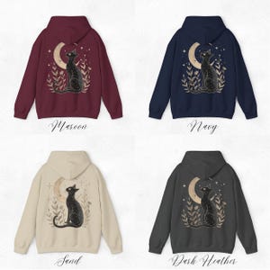 May include: Four hooded sweatshirts with a black cat design on the back. The sweatshirts are in maroon, navy, sand, and dark heather colors. The cat is looking up at a crescent moon with stars in the background.