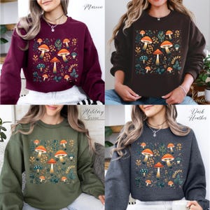 May include: Four different colored sweatshirts with a mushroom and leaf design. The colors are maroon, dark chocolate, military green, and dark heather.