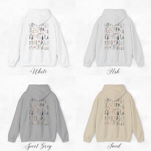 May include: Four hooded sweatshirts in different colors: white, ash, sport grey, and sand. Each sweatshirt features a floral print on the back.