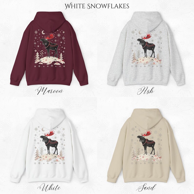 May include: Four hooded sweatshirts in maroon, ash, white, and sand. Each features a moose graphic with red antlers, a crescent moon, and snowflakes. The text "White Snowflakes" is at the top.