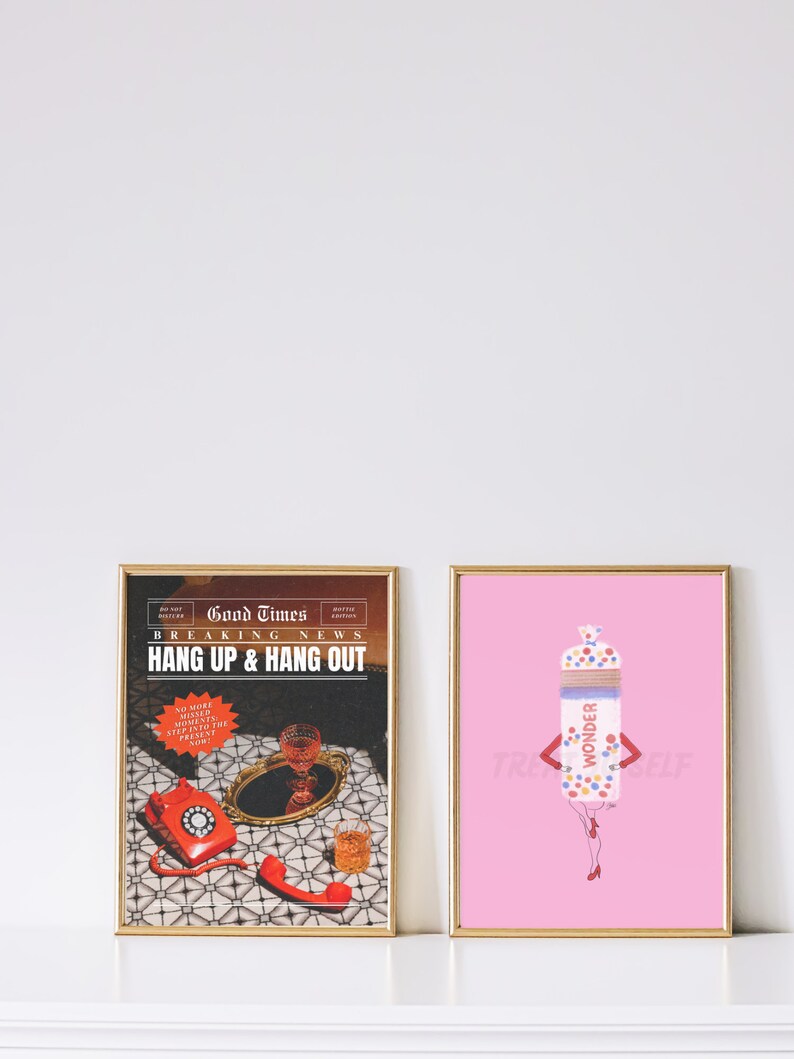 May include: Two framed prints, one with a vintage newspaper design featuring a red rotary phone and the text "Good Times Breaking News Hang Up & Hang Out", and the other with a pink background and a cartoon illustration of a person wearing a Wonder Bread bag as clothing.