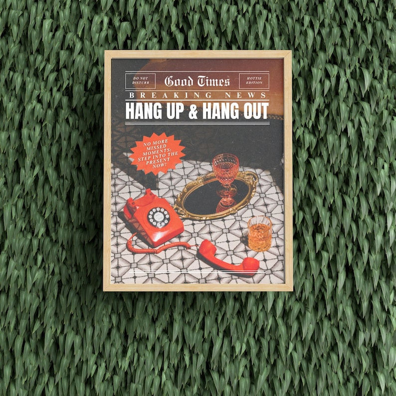 May include: A framed poster with the text "Good Times Breaking News Hang Up & Hang Out" and a red rotary phone, a glass of liquid, and a gold tray on a tiled surface.