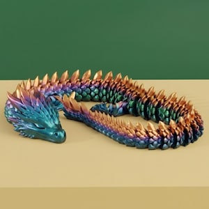 May include: A flexible, articulated dragon figurine featuring a metallic, iridescent finish that shifts between shades of deep blue, purple, green, and copper. The creature has a detailed, scaled texture with prominent, sharp-looking dorsal spines.