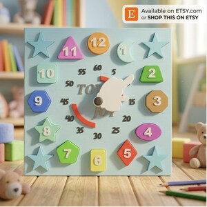 May include: A square light blue wooden clock toy featuring colorful geometric shapes as hour markers labeled 1 through 12. The clock face displays black minute increments from 5 to 60, a central white rabbit-shaped hand, and a red curved arc.