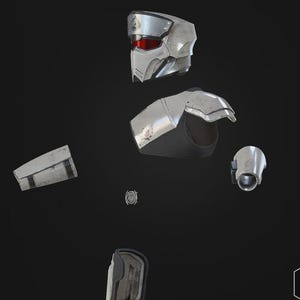 May include: A white ceramic mug with a black handle and the text "But First, Coffee" in a bold, black font. The mug is set against a blurred background, suggesting a cozy setting.