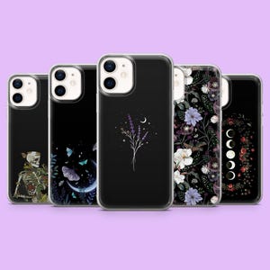 May include: A collection of black phone cases with various designs. One case features a skeleton with floral accents, another showcases butterflies and a crescent moon, and a third displays lavender and a crescent moon. The remaining cases have floral and moon phase designs.