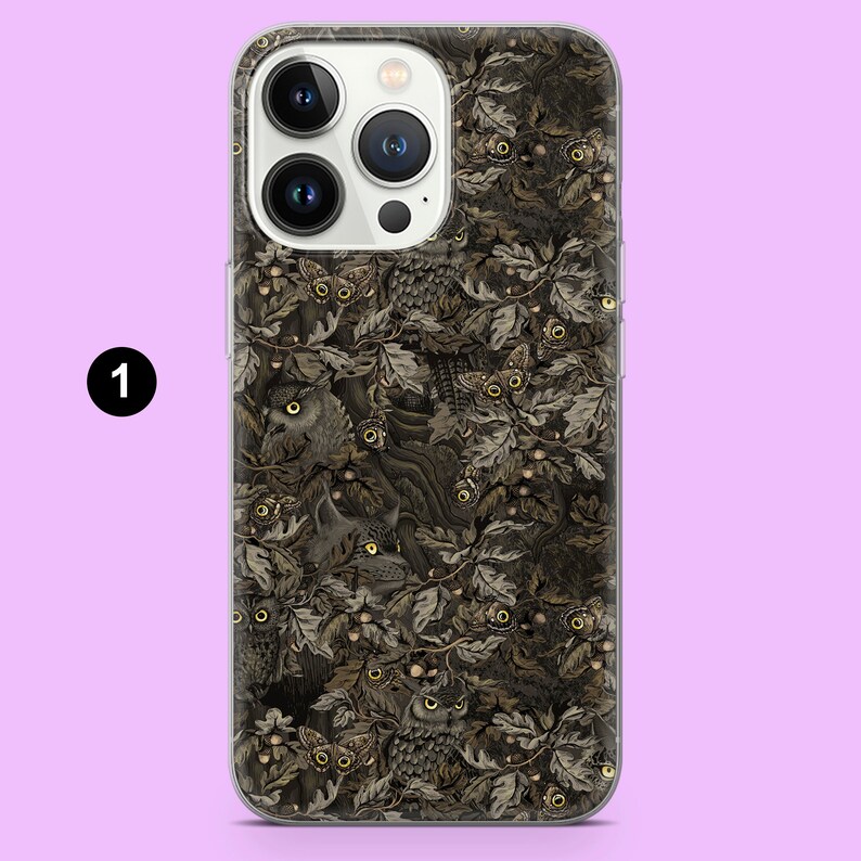 May include: A phone case with a detailed illustration of owls, moths, and foliage in shades of brown, grey, and gold. The design is a repeating pattern of woodland creatures and leaves, creating a nature-inspired aesthetic.
