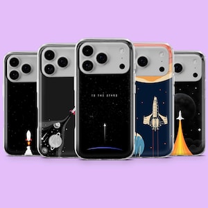 May include: Five phone cases with space-themed designs. The cases feature illustrations of rockets, planets, and starry skies. One case has the text "TO THE STARS". The cases are in clear protective covers.