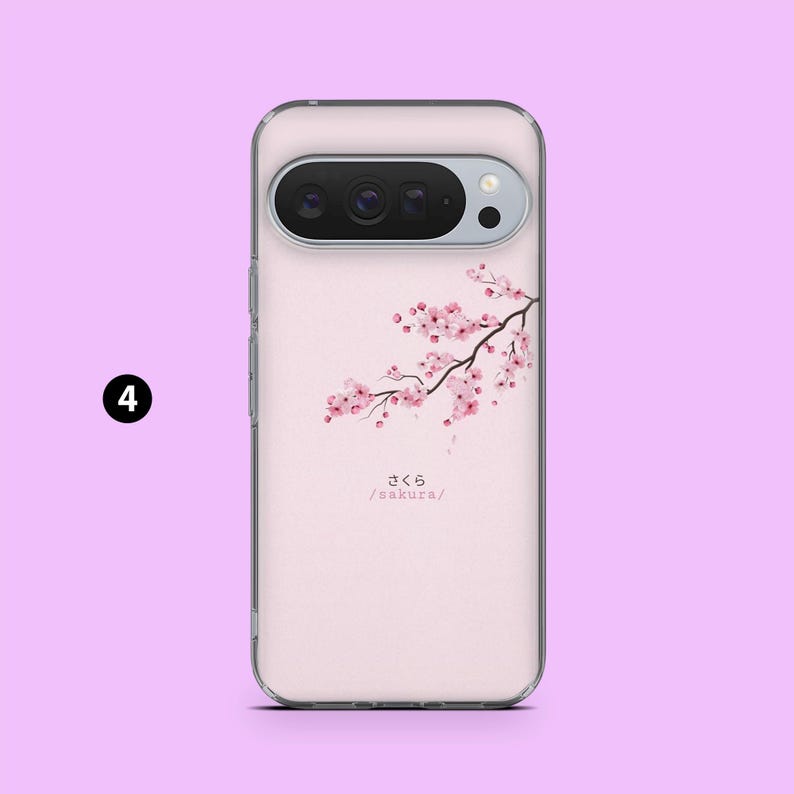 May include: A clear phone case with a pink floral branch design and cherry blossoms. The case features Japanese text reading "sakura" with the English translation below. The phone case is set against a light pink backdrop.