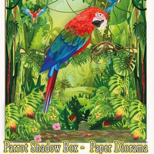 May include: A printable 3D paper diorama of a jungle scene with a red and blue parrot perched on a branch. The diorama includes lush green foliage, flowers, and vines. The text "Print, Cut, and Glue, 3D Jungle Scene" and "Parrot Shadow Box - Paper Diorama" is included in the image.