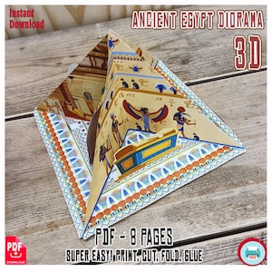 May include: A 3D Ancient Egypt diorama, featuring hieroglyphs and pharaoh imagery. The paper craft is printed with a detailed design in shades of tan, blue, and orange. Text on the image reads "Instant Download" and "PDF - 8 Pages. Super Easy! Print. Cut. Fold. Glue."