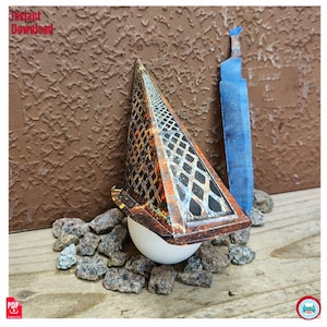 May include: A papercraft pyramid with a diamond pattern, resting on a white sphere, with a blue paper sword. The pyramid has a rusty orange and brown color scheme. The words "Instant Download" are in the top left corner.