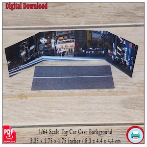 May include: A 1/64 scale toy car case background featuring a nighttime cityscape scene. The background is a three-panel design with a road section in front. The dimensions are 3.25 x 1.75 x 1.75 inches.