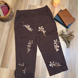 May include: A set of three ceramic mugs with a speckled, matte finish. Each mug features a different color: light blue, cream, and gray. The mugs have a simple, modern design, perfect for coffee or tea.