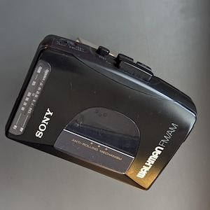 Sony Walkman WM-FX10 Cassette AM/FM Player with Orange Foam Headphones