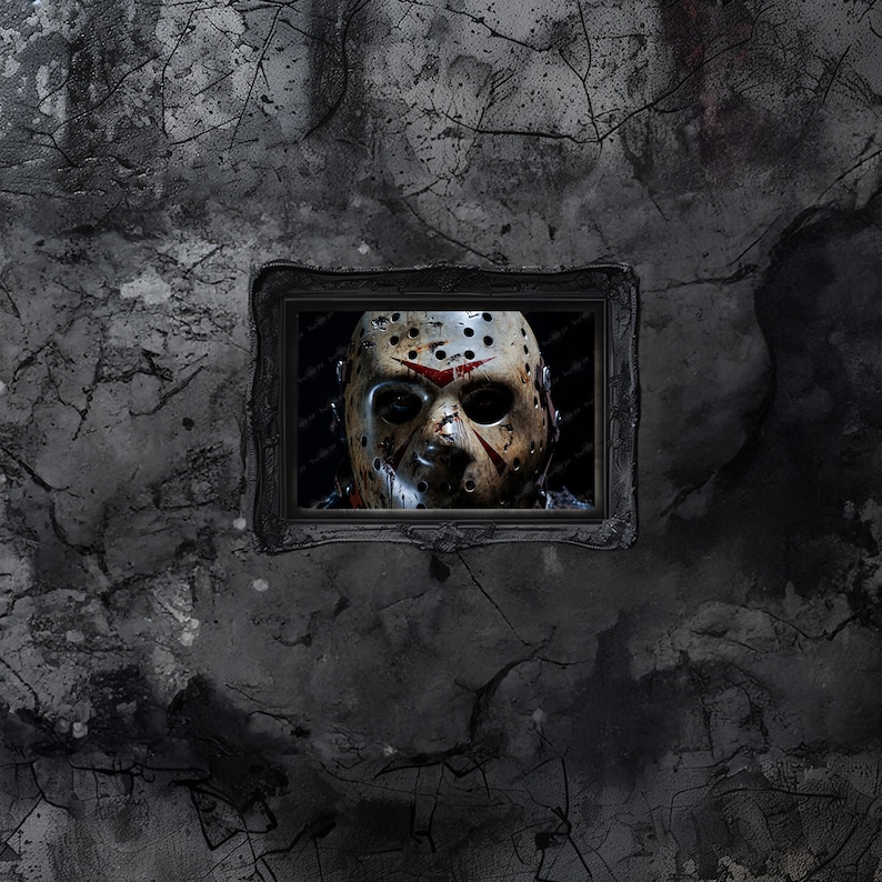 May include: A black and white photo of a hockey mask with red splatters of paint. The mask is in a black frame and is hanging on a cracked, gray wall.