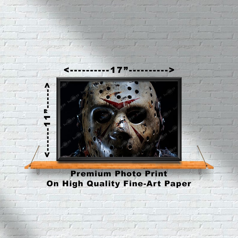 May include: A black and white photo print of a hockey mask with red blood splatters. The mask is a close-up and fills the frame. The print is 17 inches wide and 11 inches tall. Premium Photo Print On High Quality Fine-Art Paper