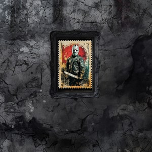 May include: A framed illustration of a horror movie character wearing a hockey mask and holding a machete. The illustration is in a vintage style with a red, white, and blue color scheme.