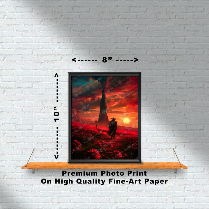 Puede incluir: Una impresi&oacute;n enmarcada de un paisaje de fantas&iacute;a con una alta torre oscura en la distancia. Una figura solitaria con un abrigo largo camina hacia la torre, con una puesta de sol roja en el fondo. La impresi&oacute;n mide 20,3 cm de ancho y 25,4 cm de alto.