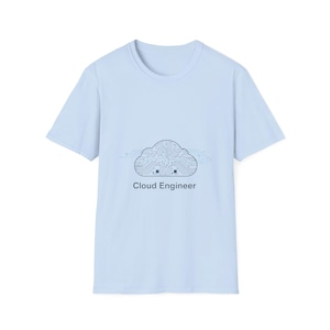May include: Light blue t-shirt featuring a cloud-shaped circuit board design with the text "Cloud Engineer" in a simple, sans-serif font. The shirt is a classic crew neck style.