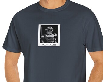 May include: A dark blue t-shirt with a vintage robot graphic in a white frame. The text "VINTAGE" is printed below the robot.