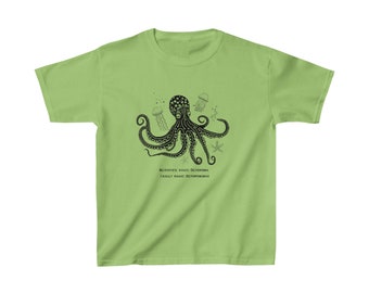 May include: A light green t-shirt featuring a black and white illustration of an octopus, jellyfish, and a starfish. The text "SCIENTIFIC NAME: OCTOPODA FAMILY NAME: OCTOPODIDAE" is printed below the illustration.