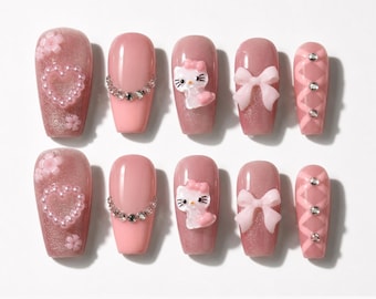 Uñas postizas Pink Coquette Hello Kitty, uñas con dije de corazón y lazo 3D, uñas Kawaii con forma de almendra, set reutilizable hecho a mano.