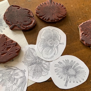 May include: A rustic wooden sign with the text "Welcome to our home" in white lettering. The sign features a distressed finish and a simple, inviting design, perfect for a front porch or entryway.