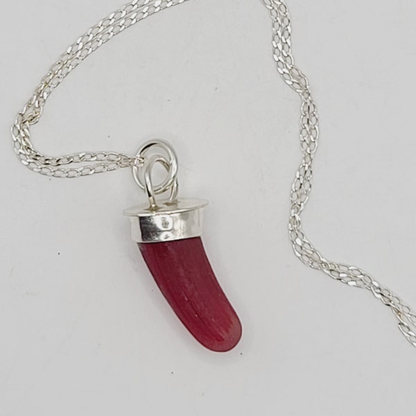 Truly unique!  RED art glass "tusk" found on the beaches of Spain.  Handmade Fine Silver bail, ready to give as a gift or wear yourself!