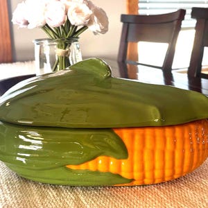 May include: A set of three ceramic mugs with a speckled, matte finish. The mugs are in shades of cream, light gray, and dark gray. Each mug has a simple, minimalist design, perfect for coffee or tea.