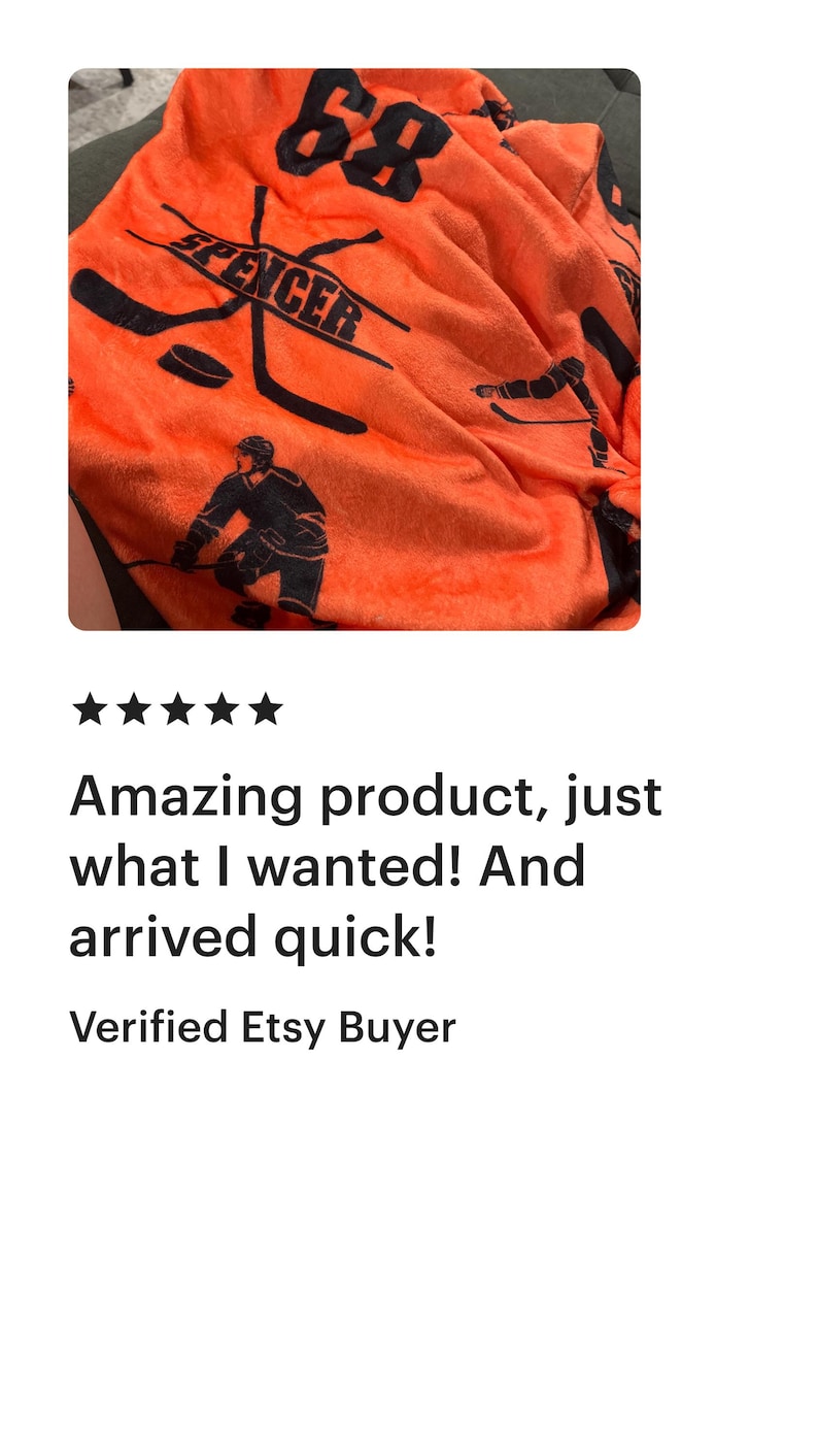 May include: Orange fleece blanket with a black hockey player design. The blanket features the number "68" and the name "Spencer" printed on it.