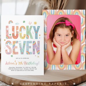 May include: Two invitations on a wooden tray. One invitation features the text "LUCKY SEVEN" in colorful letters with rainbow and star illustrations. The second invitation has a photo of a girl with a pink bow, framed by a rainbow border.