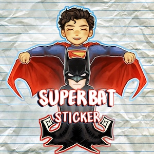 May include: A colorful sticker featuring a smiling Superman figure with a red cape, positioned above a Batman figure. The sticker has the words "SUPER BAT STICKER" in bold letters, with a decorative emblem below. The background is a lined paper texture.