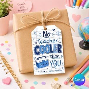 May include: A gift wrapped in brown paper, tied with twine, and a tag that reads "No Teacher Cooler Than You." The tag has a blue cooler graphic and is signed "Love, Amelia."