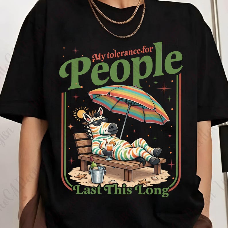 May include: Black t-shirt with a colorful graphic of a zebra relaxing on a beach chair under a rainbow umbrella. The text reads "My tolerance for People Last This Long."
